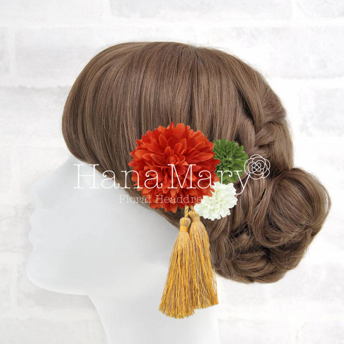 大きなオレンジのお花の髪飾り